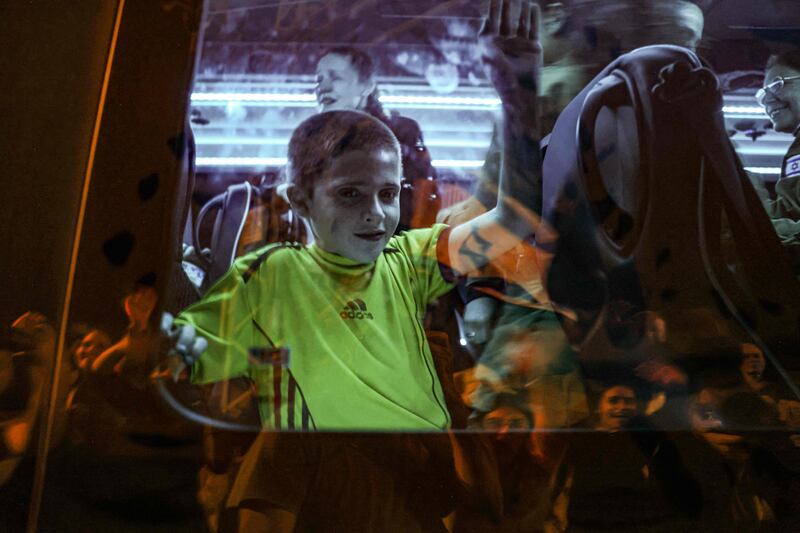 Tal Almog-Goldstein in a bus after he was released by Hamas. AFP