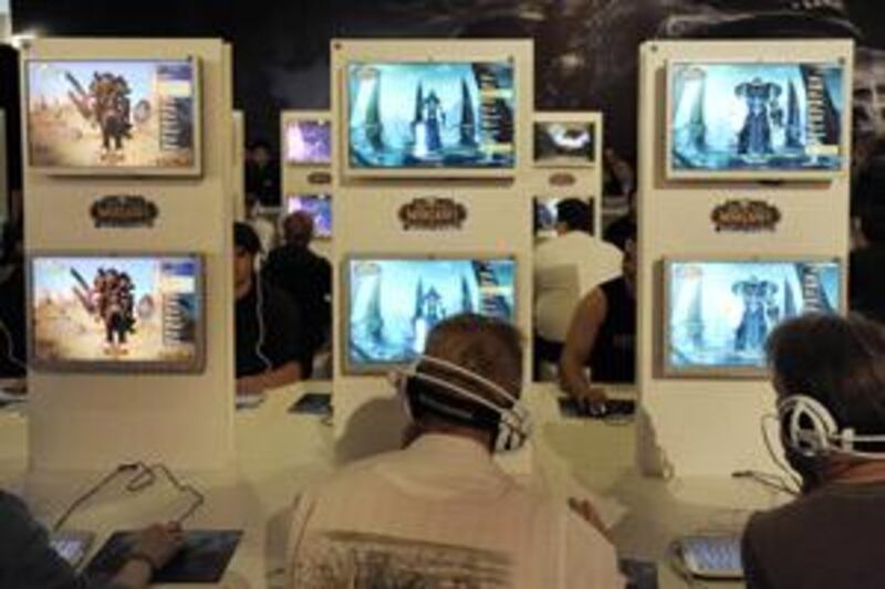 Visitors play World of Warcraft at the Games Convention, in Leipzig, Germany.