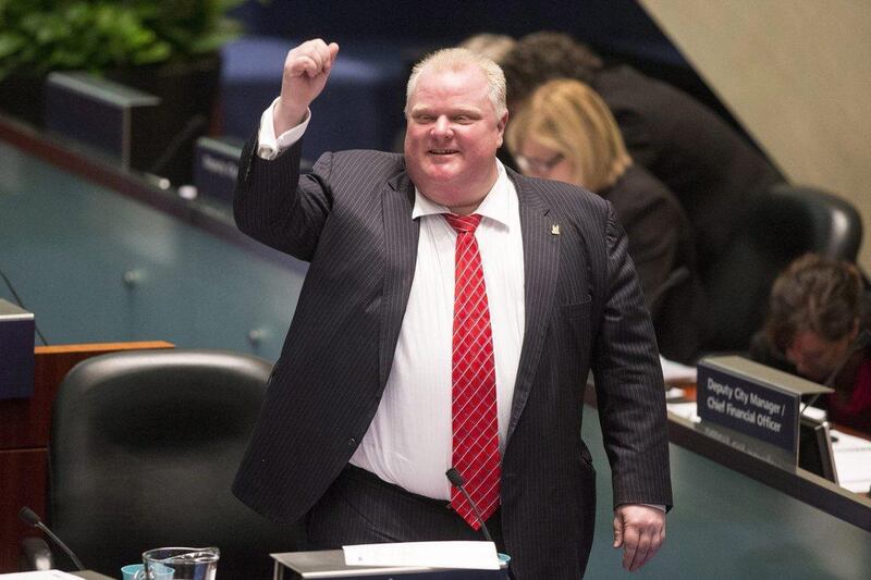 Toronto Mayor Rob Ford raises his fist in a mock salute during a chaotic council session. Chris Young / The Canada Press / AP Photo