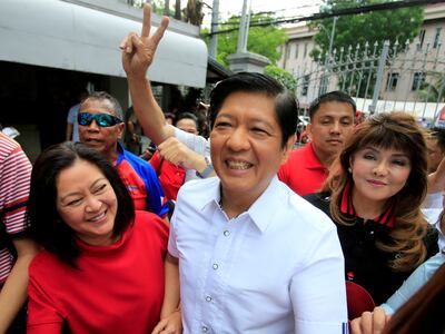 Ferdinand 'Bongbong' Marcos, son of former dictator Ferdinand Marcos, with his wife, Louise, left, and sister Imee, right. Reuters