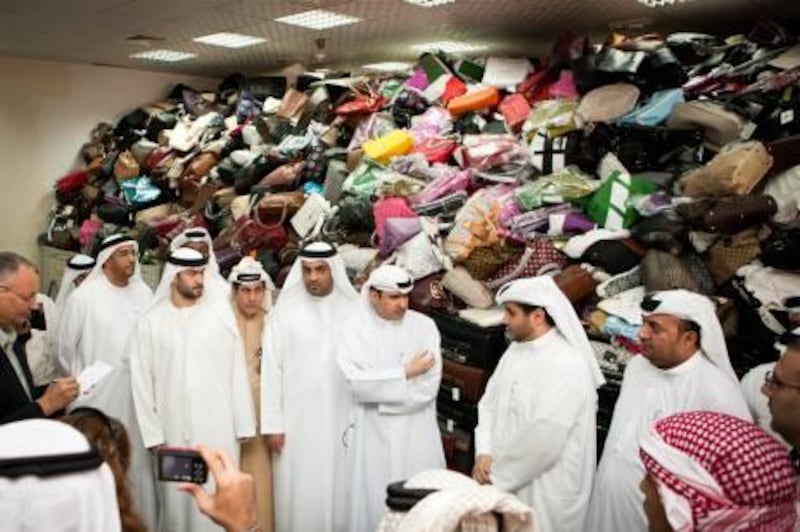 DUBAI, UAE (07/03/2011) His Excellency Mr Sami Dhaen Al Qamzi, Director General of the Department of Economic Development (DED) show cases the departments largest collection of confiscated counterfeit goods. The goods are due to be destroyed as part of the DED's crack down on illegal counterfeit goods into the UAE. (Callaghan Walsh / for The National)