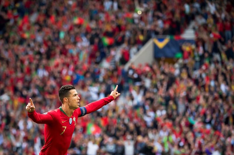 epaselect epa07628663 Portugal's Cristiano Ronaldo celebrates after scoring the 1-0 lead during the UEFA Nations League semi final soccer match between Portugal and Switzerland at the Dragao stadium in Porto, Portugal, 05 June 2019. Portugal won 3-1.  EPA/JEAN-CHRISTOPHE BOTT
