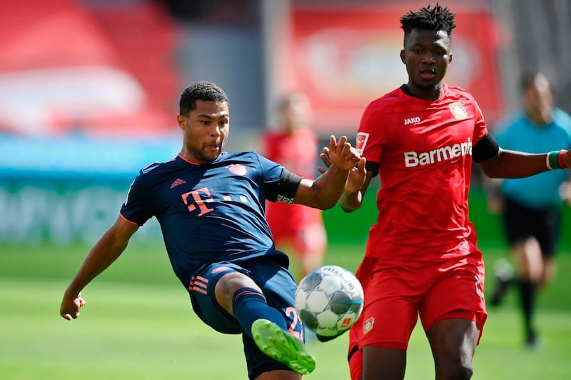 Bayern Munich midfielder Serge Gnabry (L) scores his team's third goal. AFP