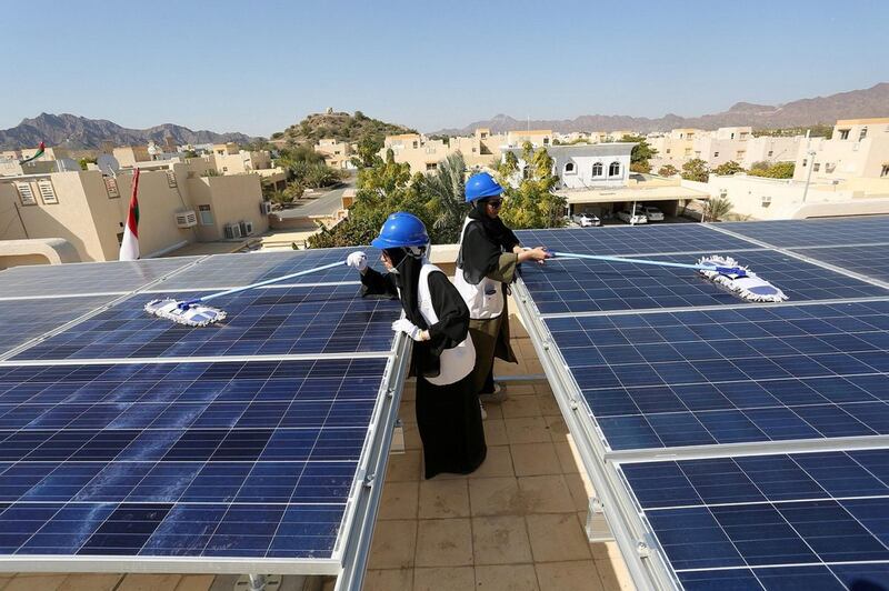 The Dubai Youth Council and the Dubai Electricity and Water Authority (Dewa) have launched a youth volunteer initiative to clean solar panels on the rooftops of houses in Hatta. Courtesy: Dubai Media Office