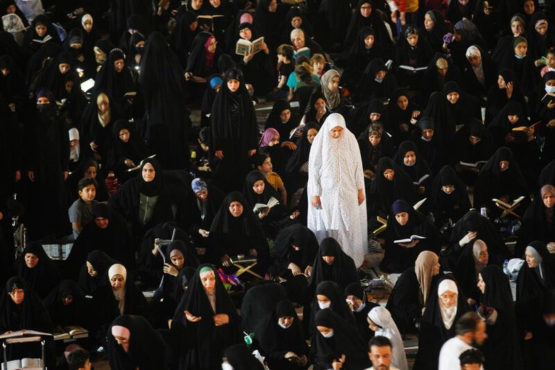 Shiite worshipers read the Quran during Ramadan at the Great Mosque of Kufa, Iraq. Reuters