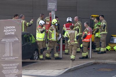 Firefighters outside the Aquatics Centre in east London after a gas leak. PA