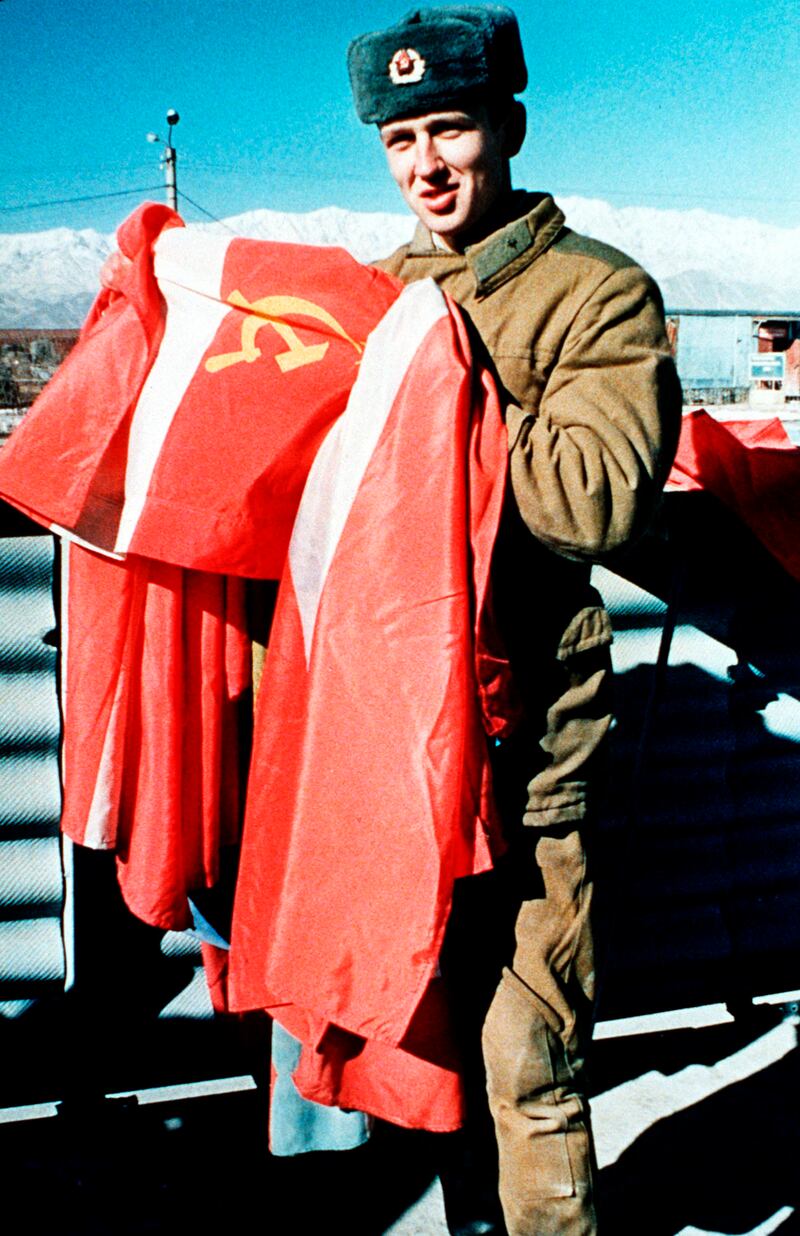 A Soviet army soldier takes down the Soviet national flag at Kabul airbase as Russian troops departed Afghanistan in 1989.   The former Soviet Union marched into Afghanistan on Christmas Eve, 1979, claiming it was invited by the new Afghan communist leader, Babrak Karmal, setting the country on a path of 40 years of seemingly endless wars. AP-Photo