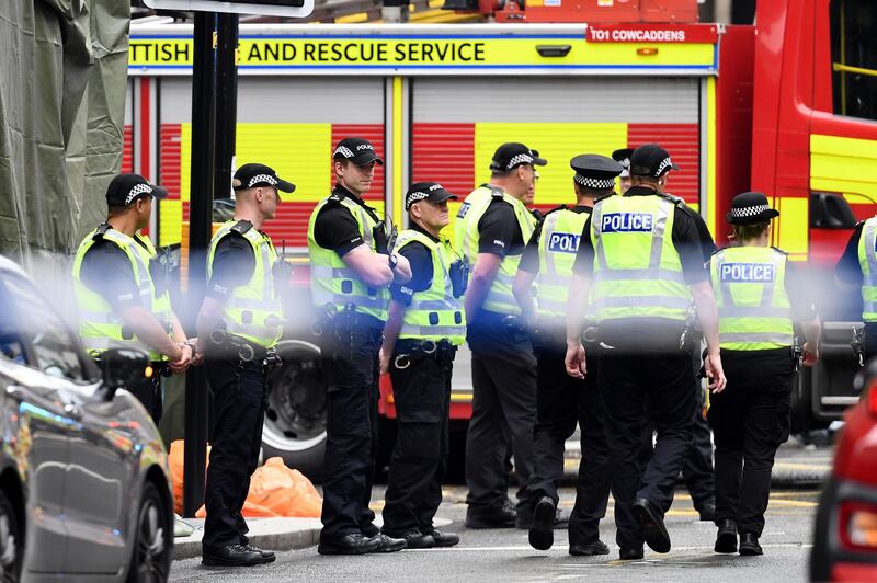 Police officers stand in front of a cordoned off area in a central Glasgow. Getty Images