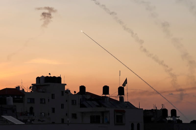 Rockets are fired from Gaza City as Israel's Iron Dome air defence system attempts to intercept them. AFP