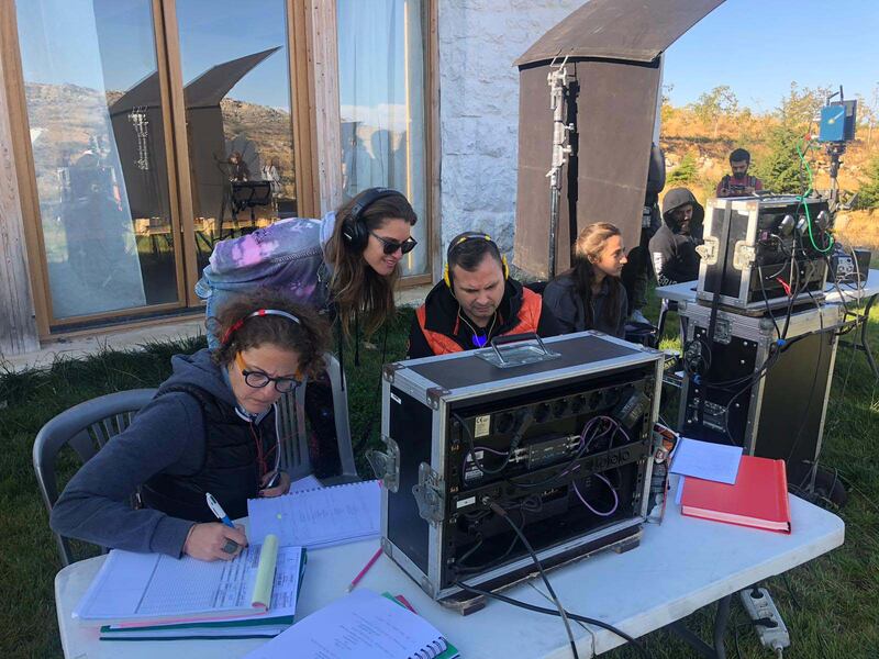 Hassiba Freiha, centre, and Kenton Oxley, right, with a member of crew on the set of Farah. Photo: Knockout Productions / Intuitive Features