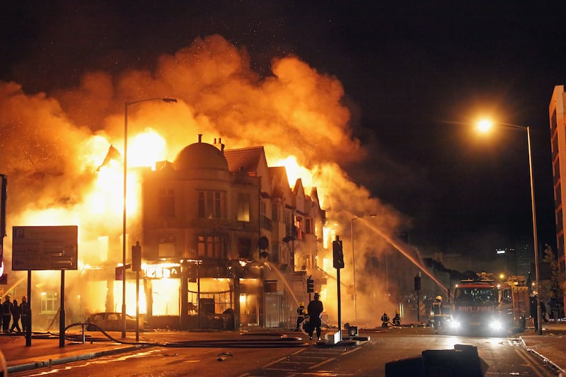 A large fire breaks out in shops and residential properties in Croydon.