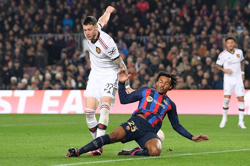 Manchester United's Wout Weghorst battles with Barcelona's Jules Kounde. AFP