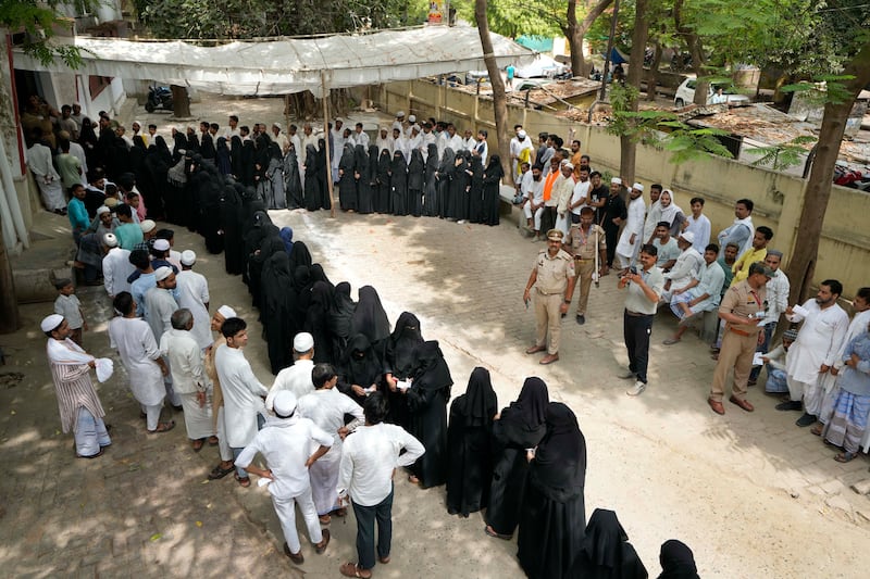 Muslim voters in Varanasi wait to cast their votes. AP Photo
