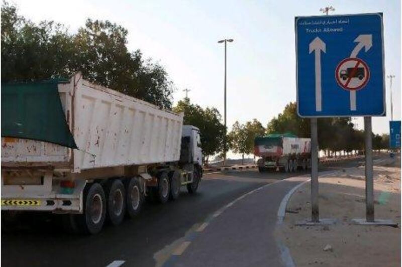 Lorries carrying raw materials to the Sheikh Khalifa Port construction site have become a frequent sight in Al Samha.