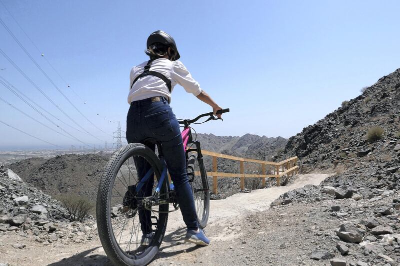FUJAIRAH, UNITED ARAB EMIRATES , March 23, 2021 – Janice Rodrigues riding the cycle at the Fujairah Adventures Park in Fujairah. (Pawan Singh / The National) For Instagram/Online/ Lifestyle. Story by Janice Rodrigues