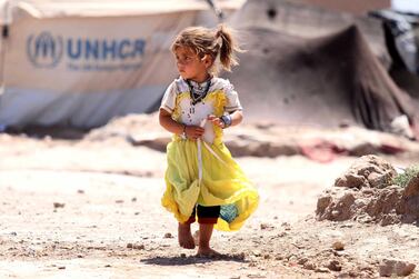 An Afghan girl, who was displaced internally due to conflict and disaster, walks at a temporary shelter provided by the United Nations High Commissioner for Refugees (UNHCR) on the outskirts of Herat, Afghanistan. EPA