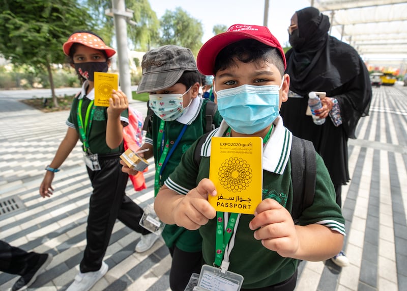 Pupils from Delhi Private School show their Expo passports. Victor Besa/The National.