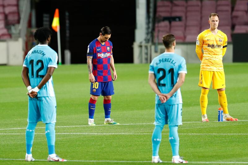 Lionel Messi holds a minute of silence prior to the match. AP Photo