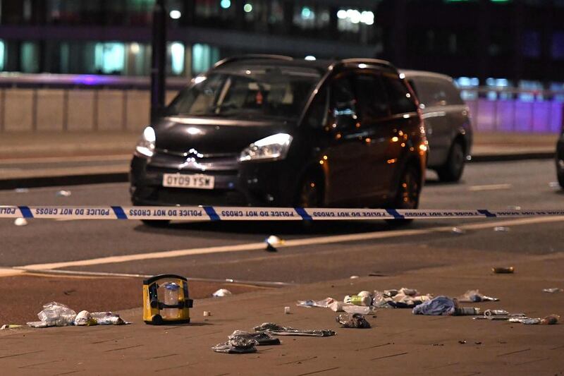 Debris and abandoned cars remain on London at the scene of the terror attack in central London. Chris Ratcliffe / AFP