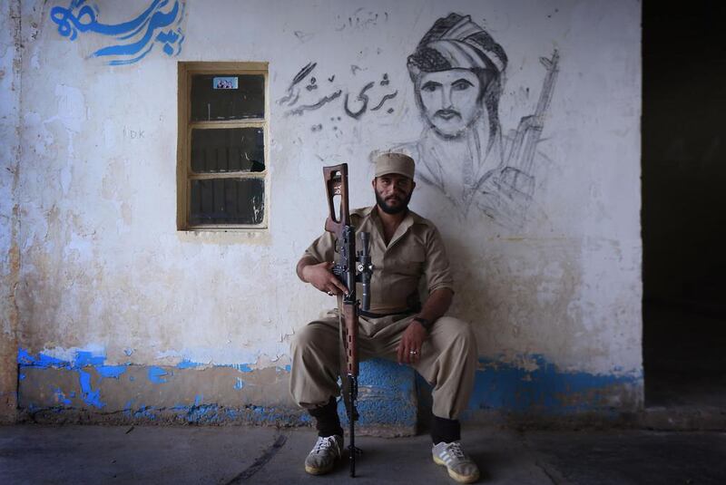 Iranian Kurdish Peshmerga members of the Kurdistan Democratic Party of (KDP-Iran) take part in routine military exercises in Koya, 100 kms north of Arbil, the capital of the autonomous Kurdish region of northern Iraq. Safin Hamed / AFP