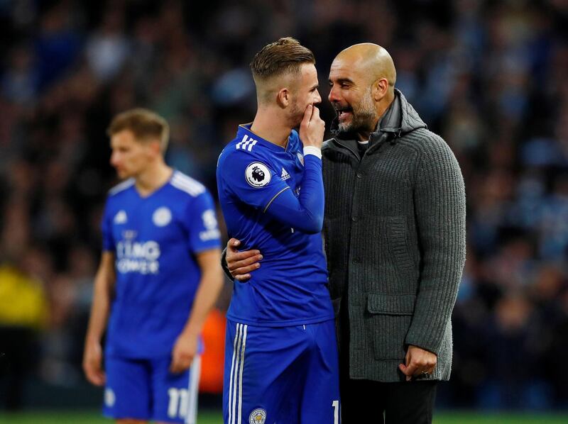 Manchester City manager Pep Guardiola with Leicester City's James Maddison. Reuters