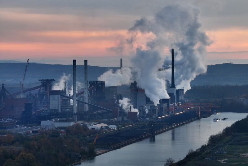 Emissions rise from a steel mill in Salzgitter, Germany. Demands are rising that countries participating in the upcoming Cop28 conference in Dubai agree on a road map for phasing out the use of fossil fuels. Getty Images