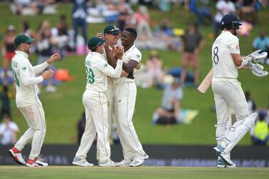 Kagiso Rabada, second right, took four wickets in the second innings including Stuart Broad's, right, to win the match for South Africa. Getty Images