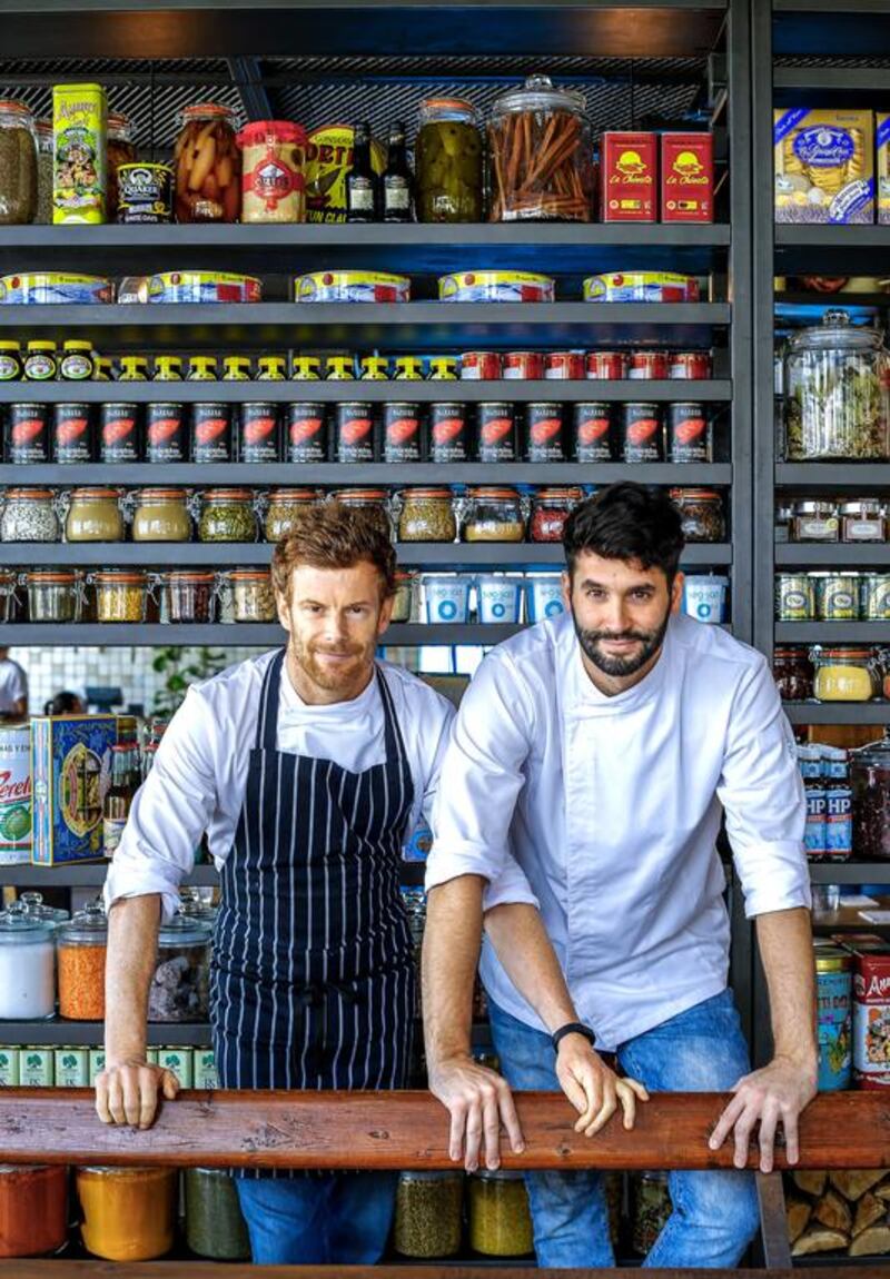Tom Aikens, left, at Pots, Pans & Boards with head chef Ibraheem Musleh. Victor Besa for The National 