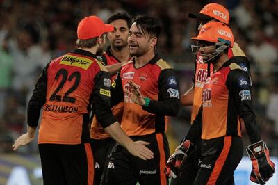 Sunrisers Hyderabad's Rashid Khan, third left celebrates dismissal of Kolkata Knight Riders' Chris Lynn during the VIVO IPL cricket T20 match in Kolkata, India, Friday, May 25, 2018. (AP Photo/Bikas Das)