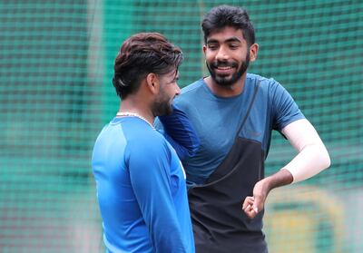 India's Jasprit Bumrah, right, shares a light moment with fellow cricketer Rishabh Pant during a training session ahead of their last T20 cricket match against South Africa in Bangalore, India, Friday, Sept. 20, 2019. (AP Photo/Aijaz Rahi)