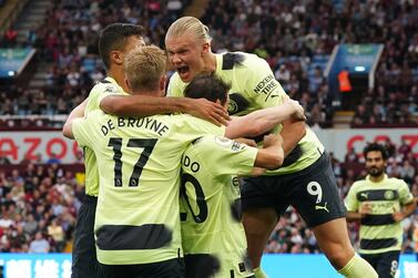 Manchester City's Erling Haaland (right) celebrates scoring their side's first goal of the game during the Premier League match at Villa Park, Birmingham. Picture date: Saturday September 3, 2022.