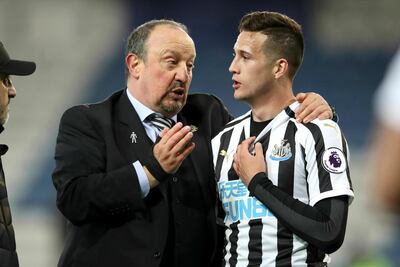 Newcastle United manager Rafael Benitez, left, and Javier Manquillo after the Premier League match at The King Power Stadium, Leicester England, Friday April 12, 2019. (Nick Potts/PA via AP)