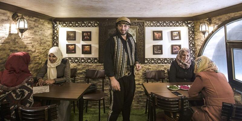 Anas Qaterji, a Syrian refugee who fled the war in Aleppo, is pictured on January 3, 2017 at his resturant in the Nuseirat Palestinian refugee camp, central Gaza, which he modelled after the establishment he left behind in Aleppo. Mahmud Hams / AFP

