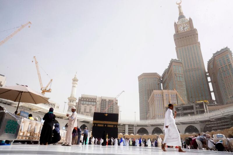 A small number of pilgrims circumambulate around the Kaaba, the cubic building at the Grand Mosque, during the minor pilgrimage, known as Umrah, in the Muslim holy city of Mecca, Saudi Arabia. At Islam’s holiest site in Mecca, restrictions put in place by Saudi Arabia to halt the spread of the new coronavirus saw far smaller crowds than usual on Monday. AP Photo