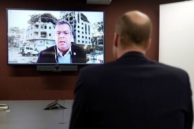 Britain's Prince William, Prince of Wales listens to Pascal Hundt, Senior Crisis Manager, International Committee of the Red Cross, dialling in on a video call from Gaza during his visit to the British Red Cross HQ. AFP