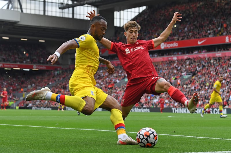 Crystal Palace forward Jordan Ayew vies with Liverpool defender Kostas Tsimikas. AFP