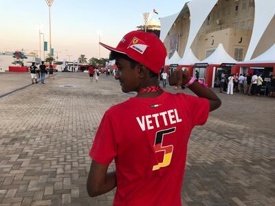 Yashish Manohar shows off the t-shirt of his favourite Formula One driver, Sebastian Vettel. Charles Capel / The National