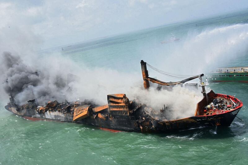 Smoke billows from the Singapore-registered container ship 'MV X-Press Pearl'. AFP