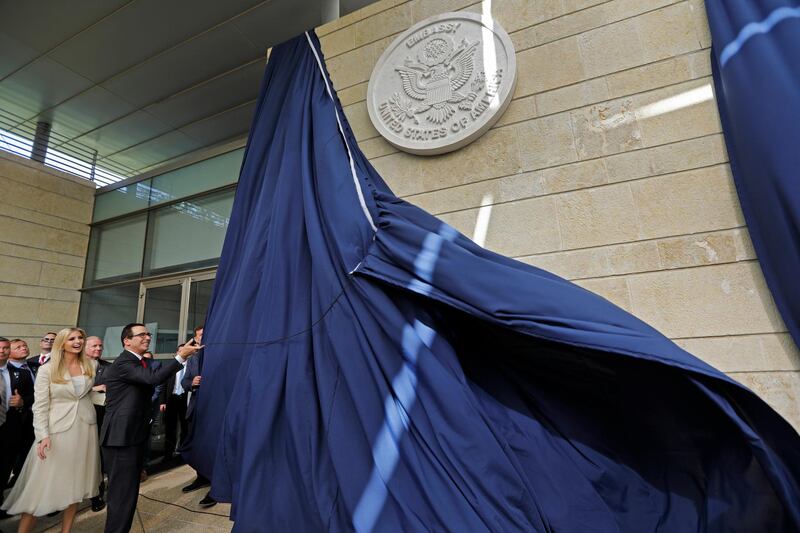 US Treasury Secretary Steve Mnuchin and US President's daughter Ivanka Trump unveil an inauguration plaque during the opening of the US embassy in Jerusalem on May 14, 2018. - The United States moved its embassy in Israel to Jerusalem after months of global outcry, Palestinian anger and exuberant praise from Israelis over President Donald Trump's decision tossing aside decades of precedent. (Photo by Menahem KAHANA / AFP)