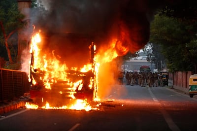 In this Sunday, Dec. 15, 2019, file photo, a passenger bus goes up in flames during a protest against Citizenship Amendment Act in New Delhi, India. Protests have been continuing over a new law that grants Indian citizenship based on religion and excludes Muslims. (AP Photo/File)