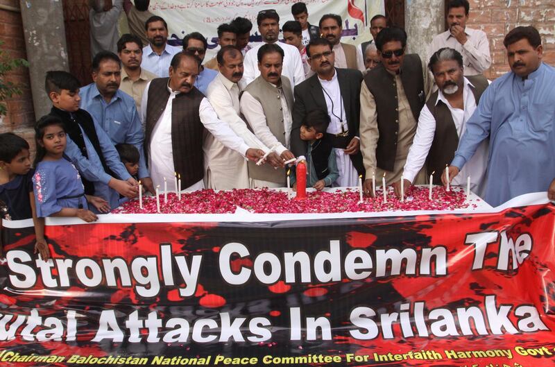 Pakistani citizens light candles at a vigil for the victims in Quetta. AP Photo