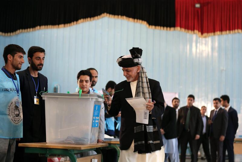 Afghanistan president Ashraf Ghani (C) casts his vote at a polling station during the presidential elections, in Kabul, Afghanistan  EPA