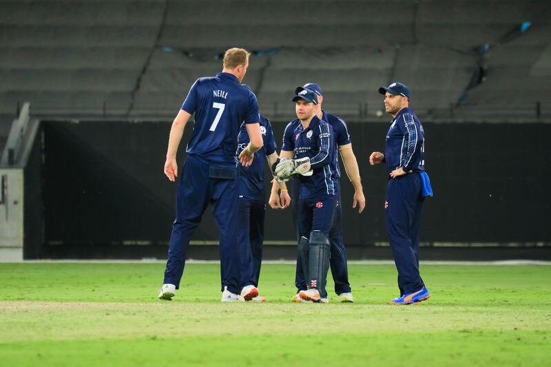 Scotland players celebrate during the match against Oman in Dubai. Photo: ICC