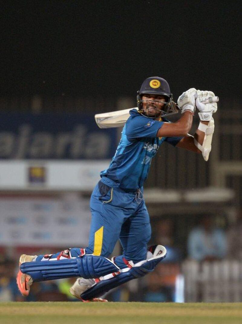 Sri Lanka captain Dinesh Chandimal plays a shot during the second T20 match against India on February 12, 2016. (AFP/DIBYANGSHU SARKAR)