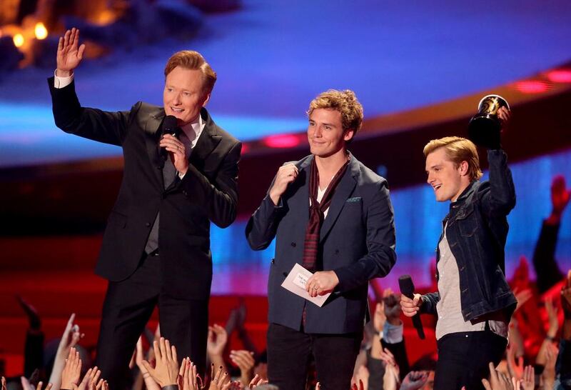 From left, Conan O'Brien, Sam Claflin and Josh Hutcherson, the stars of the Movie of the Year The Hunger Games: Catching Fire. Frederick M. Brown/Getty Images/AFP