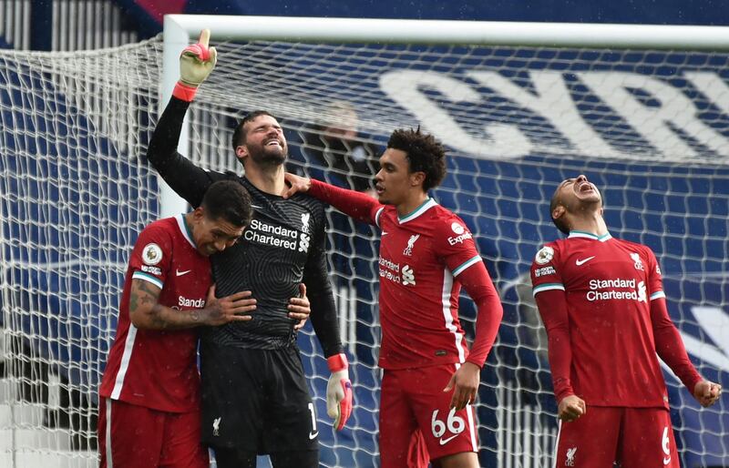 Liverpool goalkeeper Alisson celebrates scoring the winner
