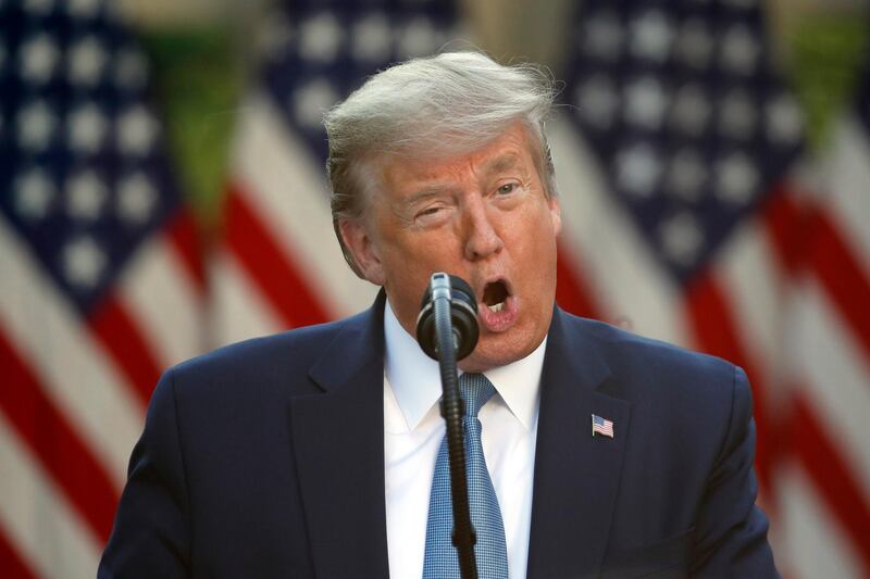 In this April 15, 2020, photo, President Donald Trump speaks about the coronavirus in the Rose Garden of the White House in Washington. President Donald Trumpâ€™s well-known disdain for foreign aid is colliding with the imperatives of fighting the coronavirus pandemic, as his administration boasts about Americaâ€™s generosity for countries in dire need while still generating confusion and anger on the global stage.  (AP Photo/Alex Brandon)