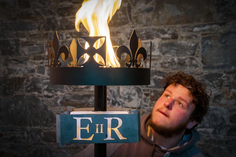 Lewis Wilde from Selkirk tests a gas-fuelled beacon he has made to signal the start of the celebrations, which will culminate with a four-day bank holiday in June. PA