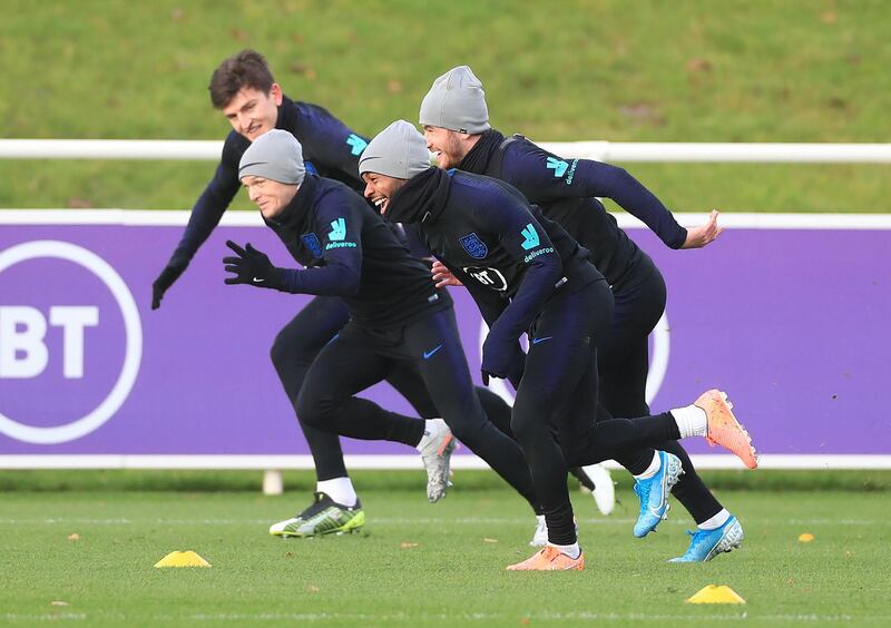 Raheem Sterling takes part in sprints during an Englan training session at St George's Park. PA