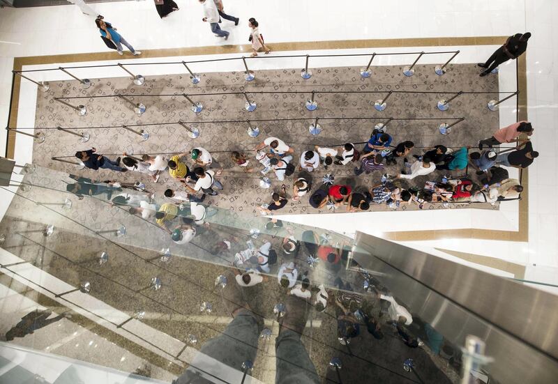 DUBAI, UNITED ARAB EMIRATES, 20 SEPTEMBER 2018 - Crowd waiting in queue to get the new iphone XS at Apple store in Dubai Mall.  Leslie Pableo for The National for Patrick Ryan’s story